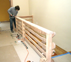 Spencer West constructing railing for the walkway